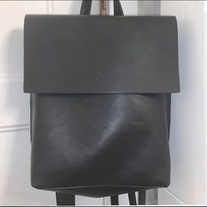 Rectangle Roots black leather backpack.